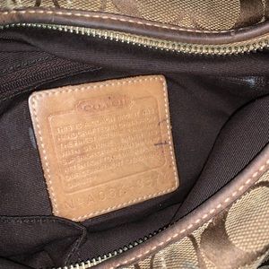 Used medium-sized tan/brown vintage leather and cloth Coach crossbody.